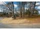 An exterior view of a modern home surrounded by trees, showcasing its unique architecture and peaceful setting at 493 Willow Springs Dr, Marietta, GA 30068