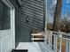 Close-up of modern home's entrance, featuring a stylish white door and a minimalist aesthetic with an outdoor lamp at 493 Willow Springs Dr, Marietta, GA 30068