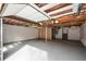 View of the unfinished garage with exposed ceiling beams at 493 Willow Springs Dr, Marietta, GA 30068