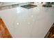 Close-up of the kitchen island with white countertop and gas stove top at 493 Willow Springs Dr, Marietta, GA 30068