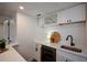 Wet bar in basement features quartz countertop, mini fridge, and wine rack at 493 Willow Springs Dr, Marietta, GA 30068