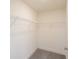 Walk-in closet with wire shelving ready to be organized for clothing and personal items at 1622 Aiden Way # 62, Conyers, GA 30013