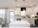 Well-appointed kitchen featuring stainless appliances, ample counter space, and elegant lighting for a contemporary feel at 1622 Aiden Way # 62, Conyers, GA 30013