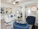 Relaxing living area with modern fireplace, stylish decor, and open design flowing into the dining and kitchen spaces at 1622 Aiden Way # 62, Conyers, GA 30013