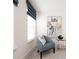 Comfortable sitting room with chair, art, and small glass table at 1622 Aiden Way # 62, Conyers, GA 30013