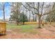 Expansive backyard featuring mature trees and a privacy fence at 2328 Carnes Rd, Jonesboro, GA 30236