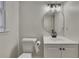 Bathroom featuring modern fixtures, vanity, and stylish mirror at 2328 Carnes Rd, Jonesboro, GA 30236