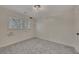 Bedroom features neutral carpet, a ceiling light, and a window with blinds at 2328 Carnes Rd, Jonesboro, GA 30236
