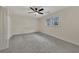 Bedroom with neutral carpet, ceiling fan, and window with blinds for natural light at 2328 Carnes Rd, Jonesboro, GA 30236
