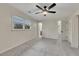 Bedroom features neutral carpet, ceiling fan, and ensuite bathroom at 2328 Carnes Rd, Jonesboro, GA 30236