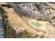 Stunning aerial view of the golf course community showcasing the lush green golf course and well-maintained homes at 250 High Court Way, Locust Grove, GA 30248