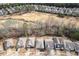 Aerial view of homes with golf course and wooded area at 250 High Court Way, Locust Grove, GA 30248