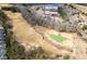 Stunning aerial view of the golf course community showcasing the lush green golf course and well-maintained homes at 250 High Court Way, Locust Grove, GA 30248