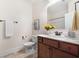Bathroom featuring a wood vanity with granite countertop and tile floors at 250 High Court Way, Locust Grove, GA 30248