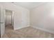 Bedroom with neutral walls, carpet flooring, and door frames at 250 High Court Way, Locust Grove, GA 30248