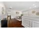 Bright dining room with white walls, hardwood floors, and seating for six at 250 High Court Way, Locust Grove, GA 30248