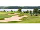 Picturesque golf course with manicured greens and sand traps, offering a challenging and scenic golfing experience at 250 High Court Way, Locust Grove, GA 30248