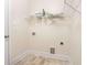 Laundry room with tile flooring, wire rack shelf, and utility connections at 250 High Court Way, Locust Grove, GA 30248