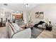 Bright open-plan living room connecting to the kitchen and dining areas, creating a welcoming space at 250 High Court Way, Locust Grove, GA 30248