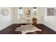Bright living room with hardwood floors, two sitting chairs, and great decor at 250 High Court Way, Locust Grove, GA 30248