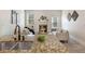 Living room featuring a granite countertop bar, fireplace, and modern sofas at 250 High Court Way, Locust Grove, GA 30248