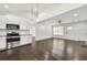 Kitchen with stainless appliances, subway tile backsplash, and hardwood floors throughout at 298 Harper Se Rd, Atlanta, GA 30315