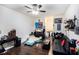 Bedroom with wood floors, a ceiling fan, and large windows at 424 Remington Ct, Villa Rica, GA 30180