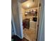 Convenient laundry room with washer, dryer, and storage shelves for supplies at 1426 Brookmere Way, Cumming, GA 30040