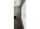 Bedroom featuring carpet floors, large windows with blinds, and neutral wall paint at 215 Bradley St, Covington, GA 30016