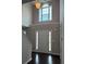 Bright foyer features a high ceiling, pendant lighting, and an arched window above the front door at 215 Bradley St, Covington, GA 30016