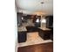 Well-equipped kitchen with granite countertops, stainless steel appliances, and a tile floor accent at 215 Bradley St, Covington, GA 30016