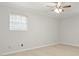 Spacious bedroom offers a large window, neutral walls, and plush carpet at 3067 Orbit Cir, Ellenwood, GA 30294