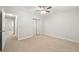 Bedroom featuring neutral walls, carpet, and a mirrored closet at 3067 Orbit Cir, Ellenwood, GA 30294