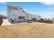 Large backyard with a concrete patio, partially dormant grass and a wooden fence creating a private outdoor space at 615 Ceremony Way, Acworth, GA 30102