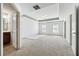 Bright and spacious bedroom with a tray ceiling, carpet, and abundant natural light from multiple windows at 615 Ceremony Way, Acworth, GA 30102