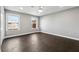 Spacious bedroom featuring hardwood floors, neutral walls, and windows offering natural light at 615 Ceremony Way, Acworth, GA 30102