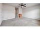 Spacious bedroom with neutral carpeting, a ceiling fan, and a chest of drawers at 615 Ceremony Way, Acworth, GA 30102