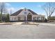 Attractive community clubhouse featuring stone accents, a covered porch, and well-manicured landscaping at 615 Ceremony Way, Acworth, GA 30102
