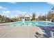 Large community pool with lane lines and clear blue water, surrounded by a spacious concrete deck at 615 Ceremony Way, Acworth, GA 30102