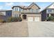 Charming two-story brick home with well-manicured lawn and attached two-car garage at 615 Ceremony Way, Acworth, GA 30102