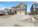 Beautiful two-story brick home featuring an attached two-car garage and expansive driveway at 615 Ceremony Way, Acworth, GA 30102