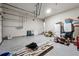 A cluttered two car garage with plenty of space for vehicles and storage at 615 Ceremony Way, Acworth, GA 30102