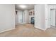 Spacious hallway with neutral paint, carpet, and multiple doors, offering access to different rooms at 615 Ceremony Way, Acworth, GA 30102