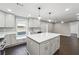 Contemporary kitchen with white island, stainless steel appliances, and a cozy window nook at 615 Ceremony Way, Acworth, GA 30102