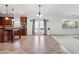 Open kitchen featuring cherry cabinets, black countertops, and stainless steel appliances at 615 Ceremony Way, Acworth, GA 30102