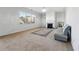 Inviting living room with a fireplace, large window, and comfortable seating area at 615 Ceremony Way, Acworth, GA 30102