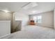Upstairs loft featuring neutral walls and carpeting, perfect for a playroom or home office at 615 Ceremony Way, Acworth, GA 30102