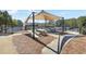 Shaded community picnic area with multiple wooden picnic tables and nearby tennis courts for outdoor gatherings at 615 Ceremony Way, Acworth, GA 30102