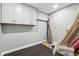 A cluttered storage area with wooden cabinets at 615 Ceremony Way, Acworth, GA 30102