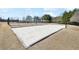 Community sand volleyball court with a net and boundary markers, set in a well-maintained recreational area at 615 Ceremony Way, Acworth, GA 30102